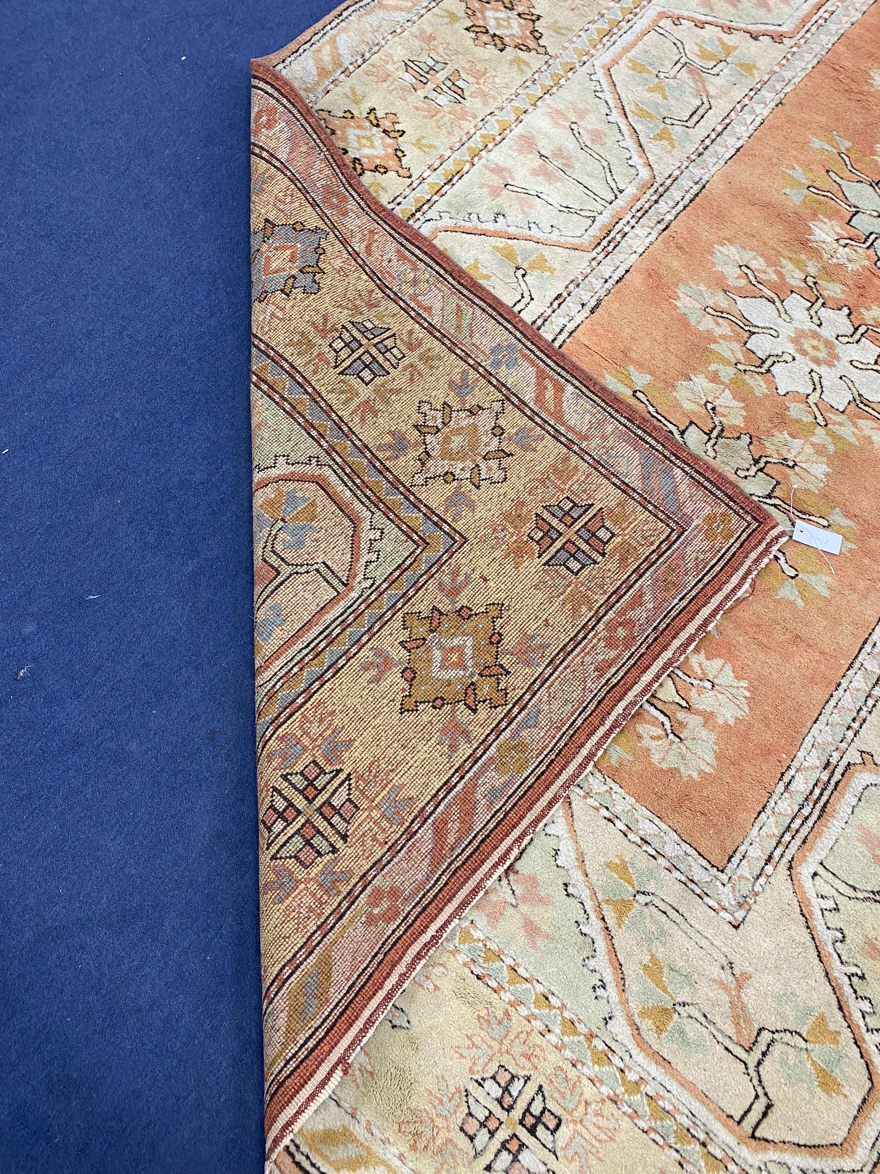 A Turkish pale green ground rug, 270 x 196cm